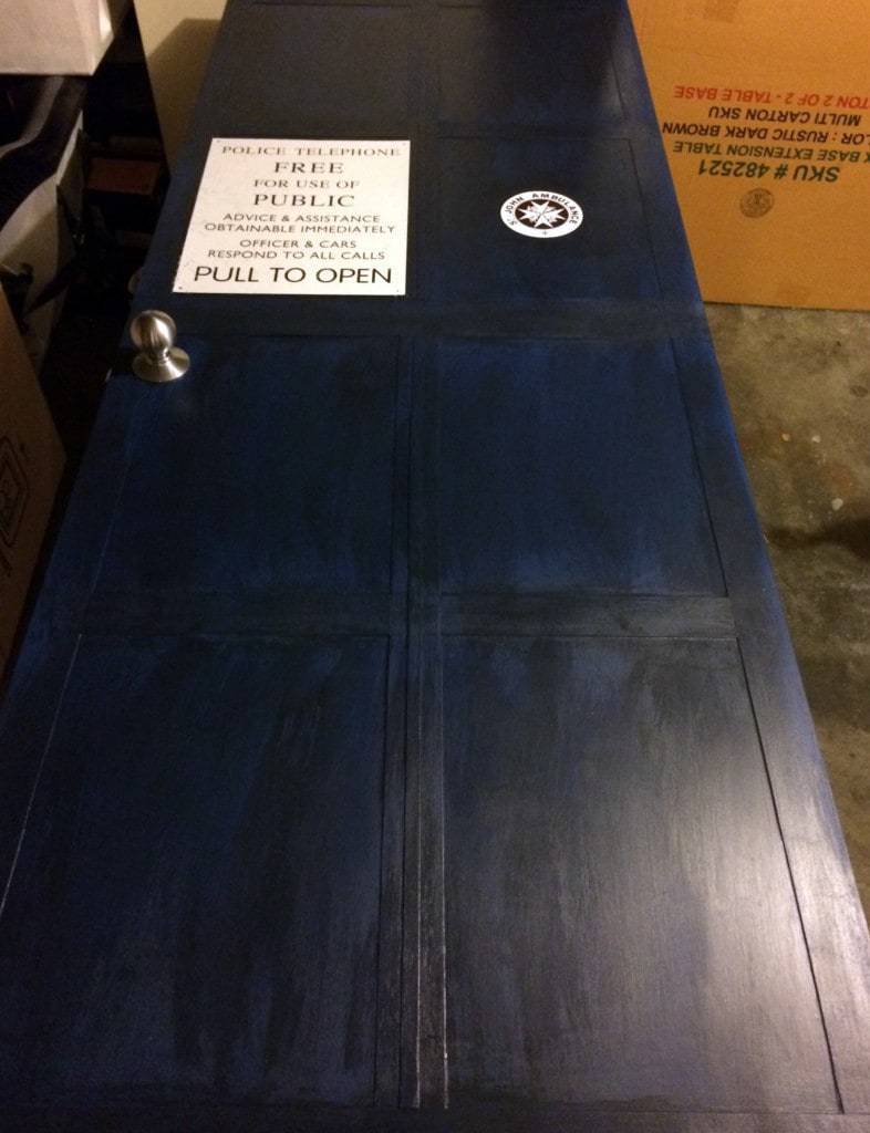 painted TARDIS door with signs