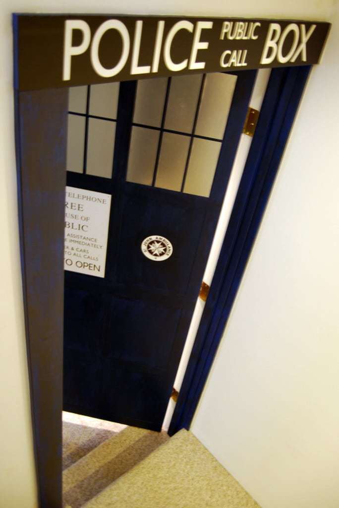 partially opened TARDIS door entryway to media room