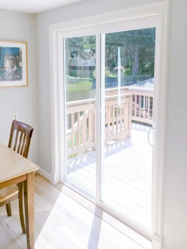 sliding glass door with new plinth blocks installed at bottom of trim