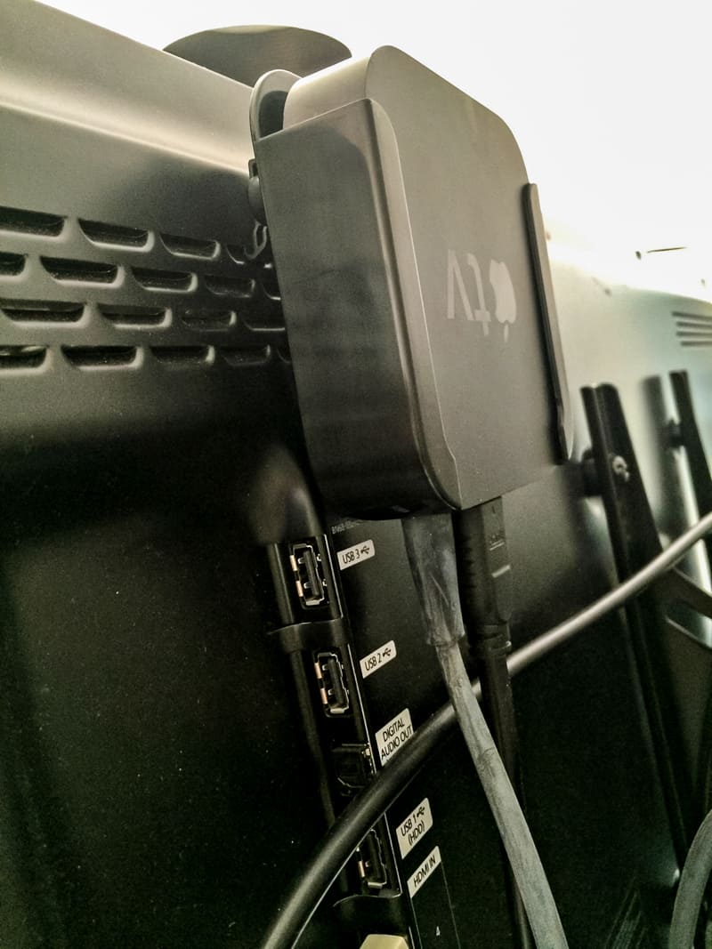 Apple TV mount installed behind TV