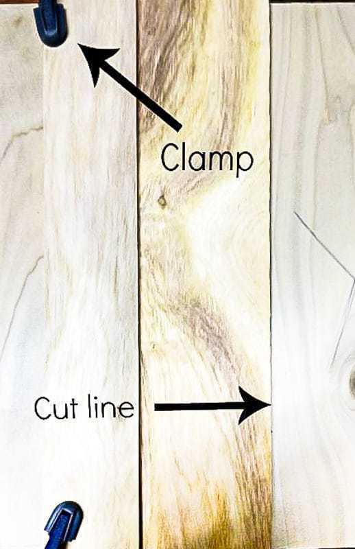 circular saw jig clamped to plywood to be cut