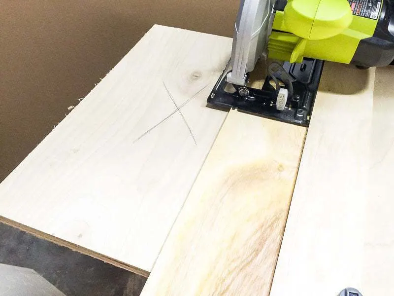 circular saw cutting plywood using a circular saw jig.