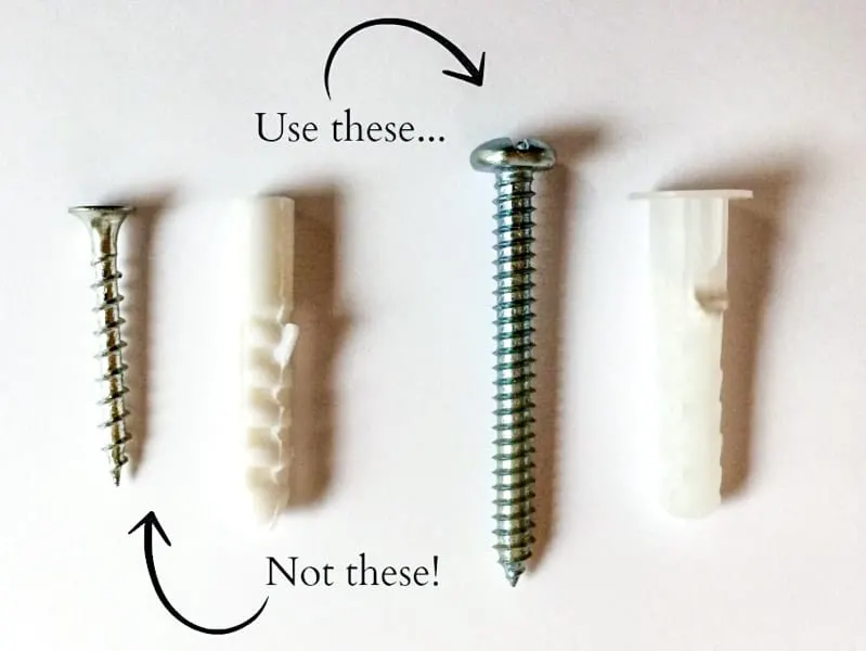 comparison of wall anchors included with bathroom corner cabinet versus heavy duty wall anchors