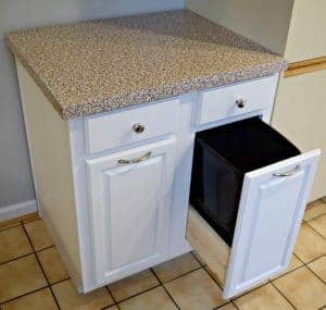 Diy Pull Out Trash Can Cabinet Tutorial The Handyman S Daughter I Converted A Beat Up Salvage Yard Cabinet Into Functional Piece With Hidden Trash