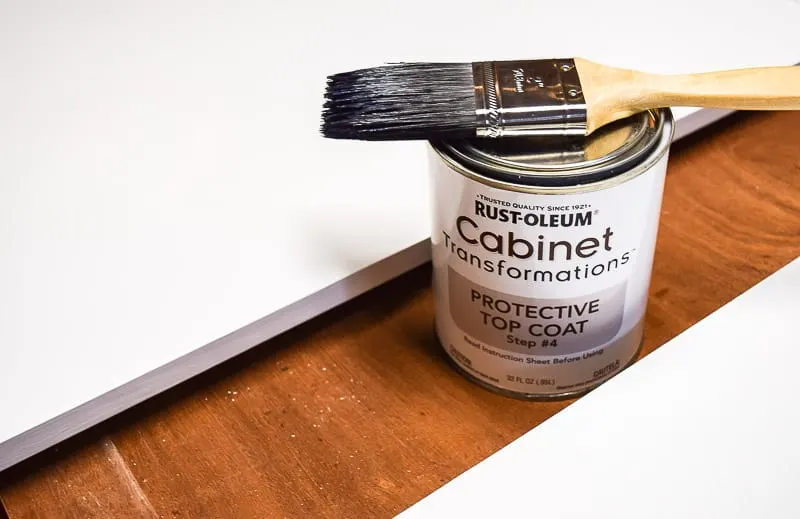 cabinet doors with Rustoleum Cabinet Transformations top coat can and paint brush