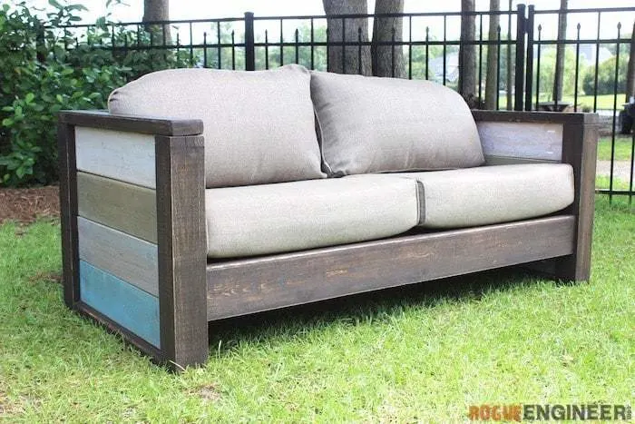 DIY outdoor sofa with cushions and varied colors on arm rests