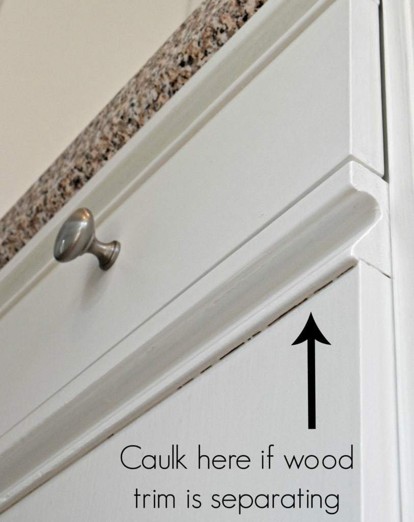 caulk any gaps if the wood trim is separating from the door The