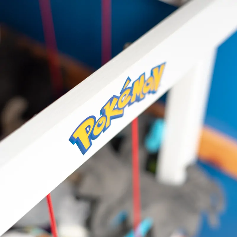 pokemon sticker on side of DIY stuffed animal zoo frame