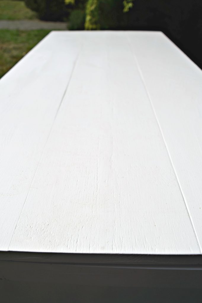 The cracks between the boards of the storage bench lid were caulked to prevent water from seeping through, but not so much that it took away the planked look - thehandymansdaughter.com