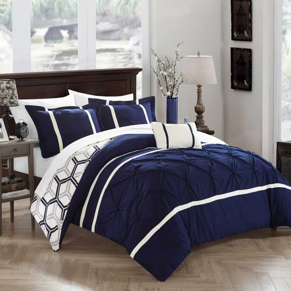 navy blue and gray bedding with reversible pattern