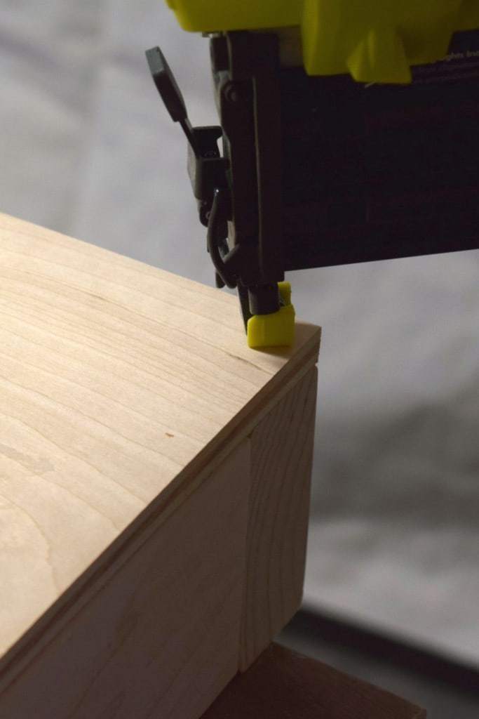 attach the plywood top to the frame with nails or countersunk screws