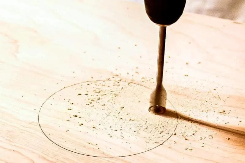 Drill a hole for the jigsaw blade to slide into.
