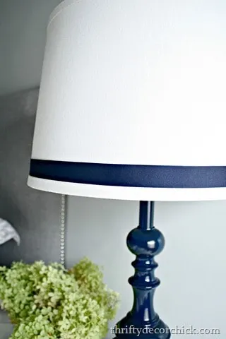 navy blue lamp with ribbon on lampshade