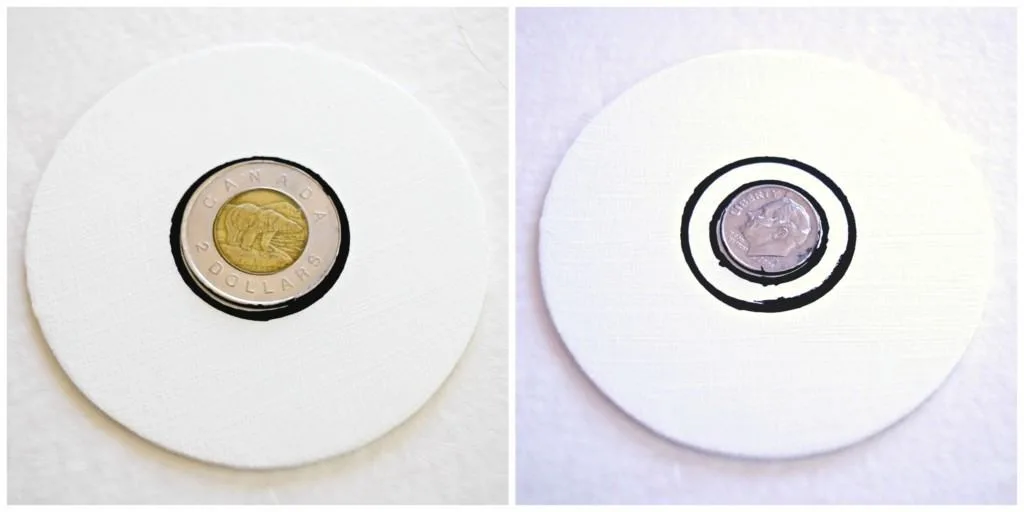 tracing coins with a black paint pen to create concentric circles