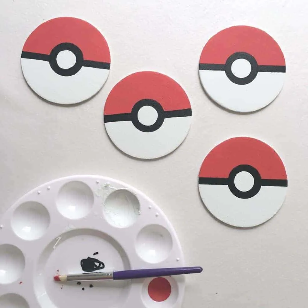 wooden circles painted to look like pokeballs