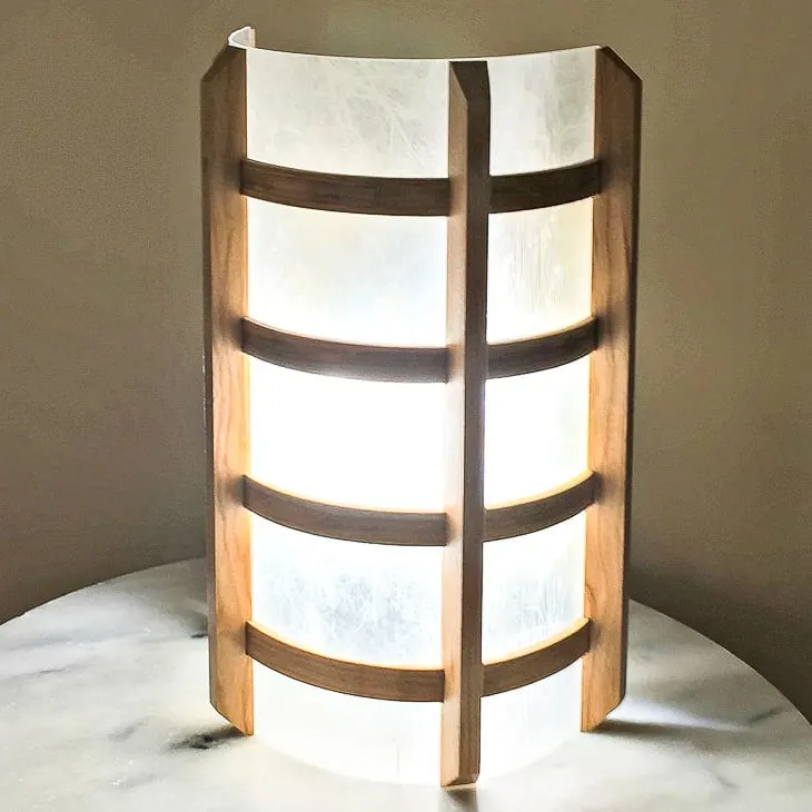 DIY wooden wall sconce on a marble table