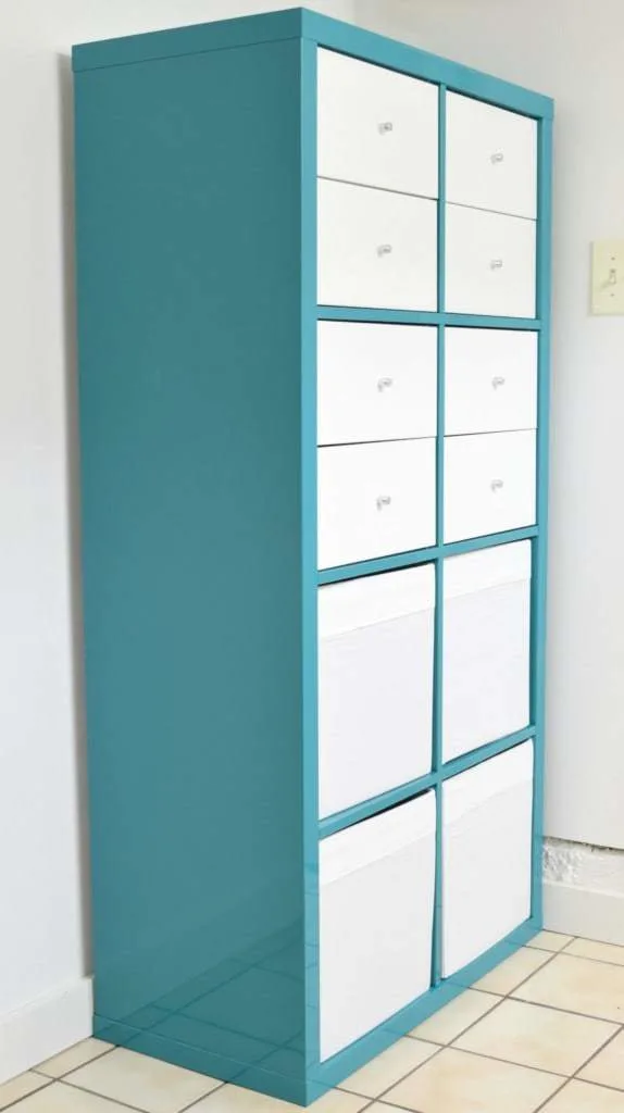 turquoise IKEA Kallax with white drawers and bins