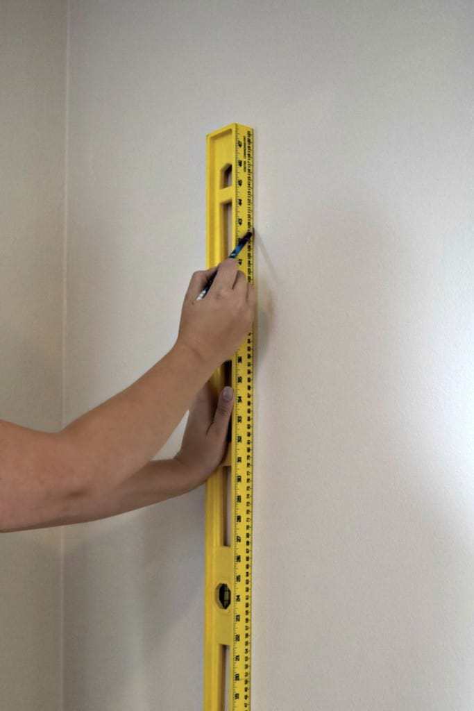 Draw a level vertical line a few inches less than the width of your wallpaper to mark as a starting point - The Handyman's Daughter