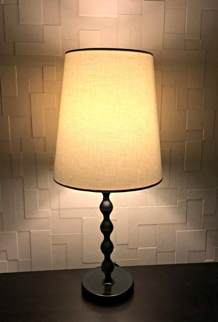The glow of our nightstand lamps really shows off this amazing textured wallpaper. - The Handyman's Daughter