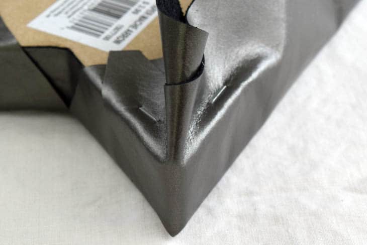 corner of DIY arrow decor wrapped in leather
