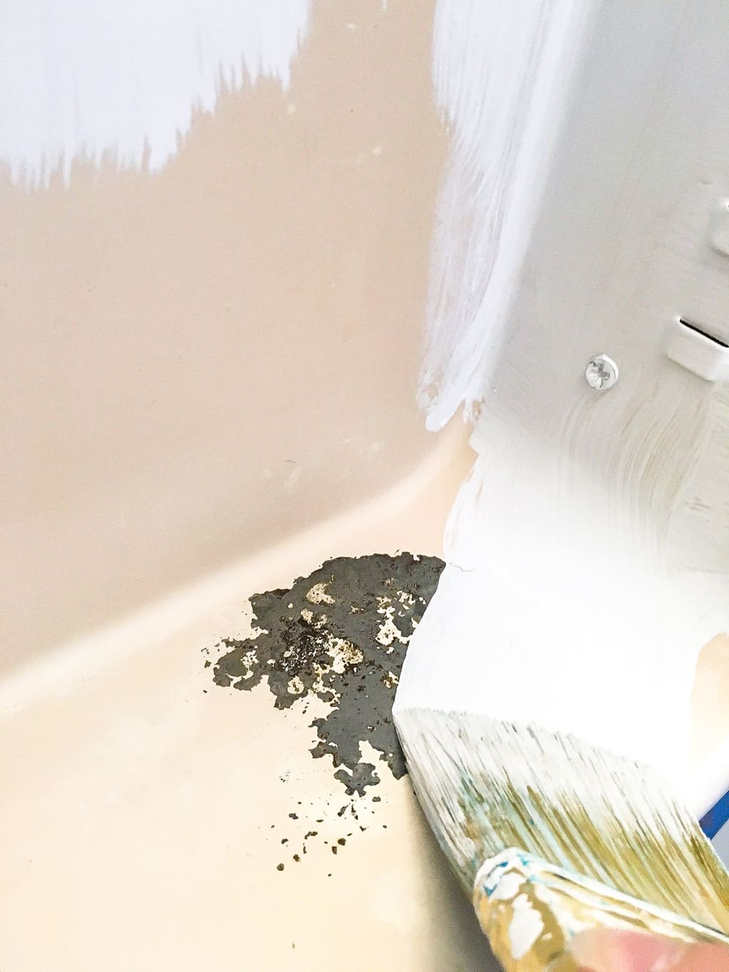 painting primer on metal medicine cabinet over rust spots