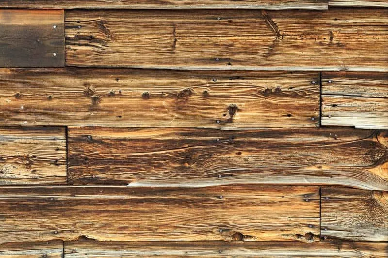reclaimed wood wall with nail holes