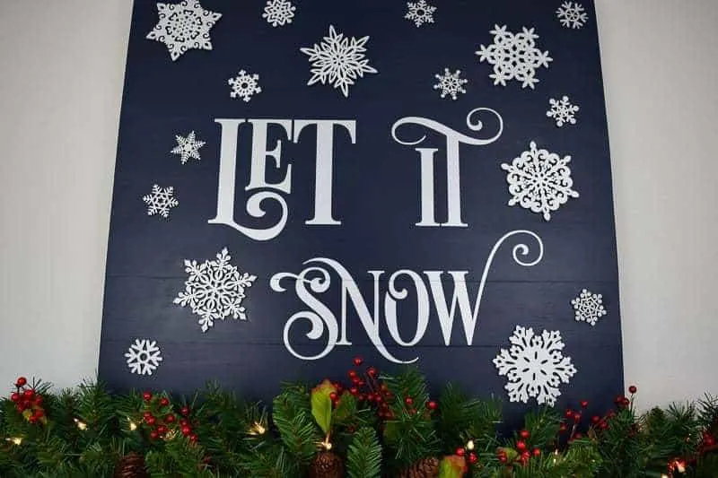 DIY wood Let it Snow sign on fireplace mantle