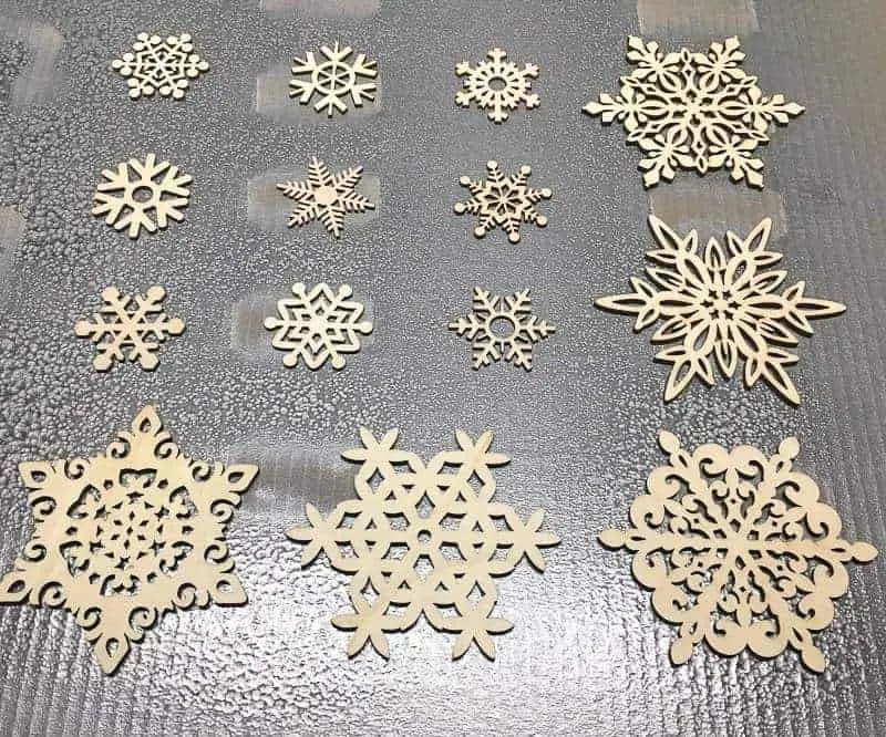 painting wooden snowflake ornaments silver with spray paint