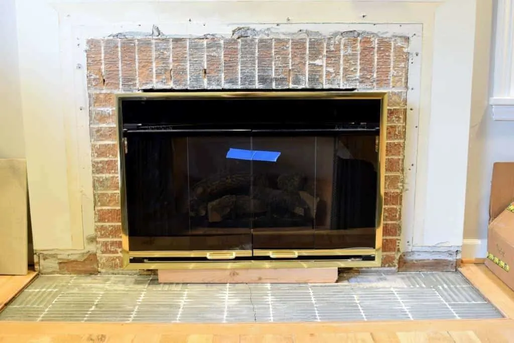 fireplace demolition complete with old brick exposed