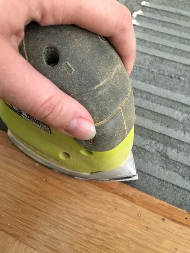 sanding hardwood floor around fireplace hearth