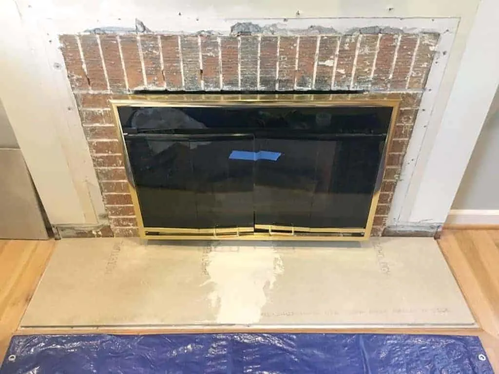 new fireplace hearth built from cement backer board before new tile is installed