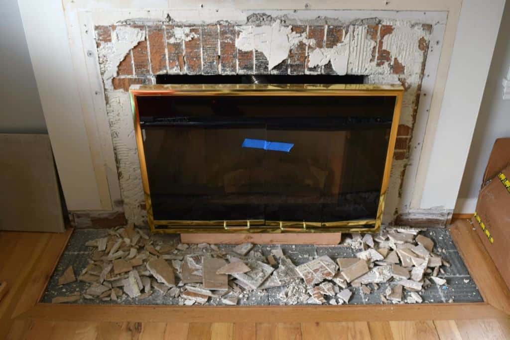 brick fireplace with tile removed