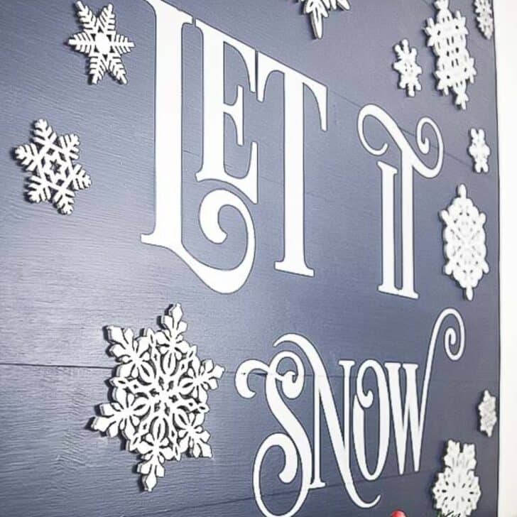 DIY Let it Snow sign with 3D snowflakes on a wooden board
