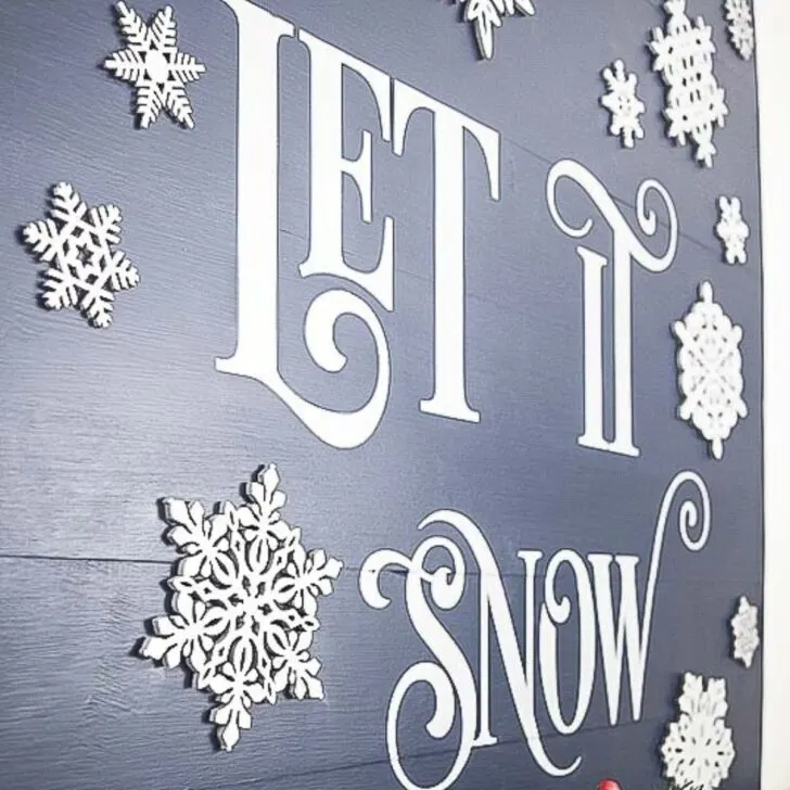 DIY Let it Snow sign with 3D snowflakes on a wooden board