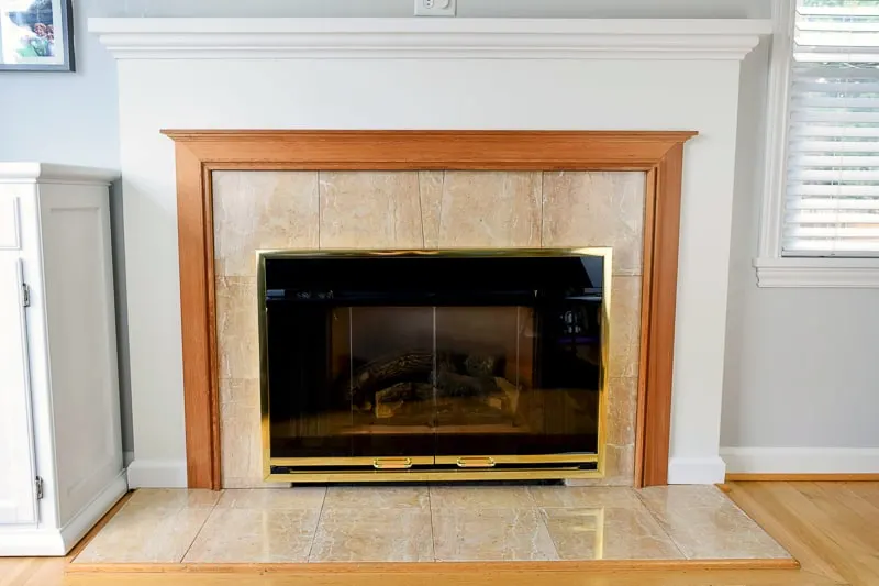 fireplace tile before - peach marble and orange oak fireplace surround