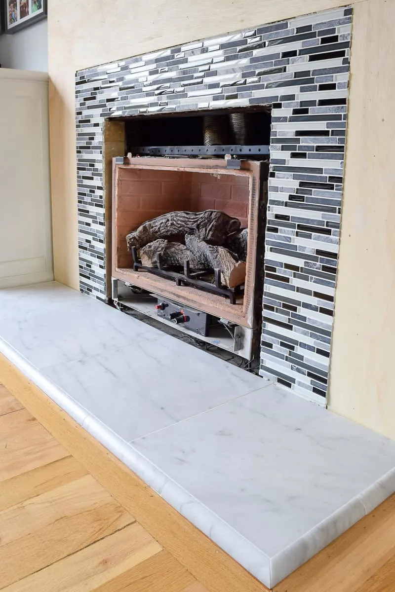 completed fireplace tile installed around firebox