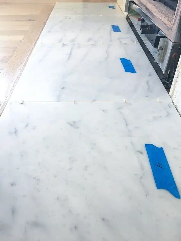 large format marble tiles on fireplace hearth