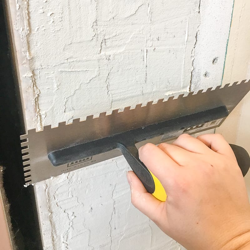 smoothing surface of mortar with a large trowel