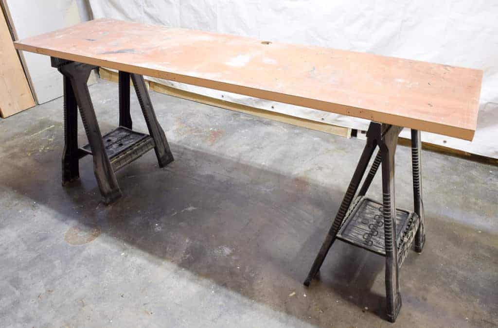 old door on top of two sawhorses