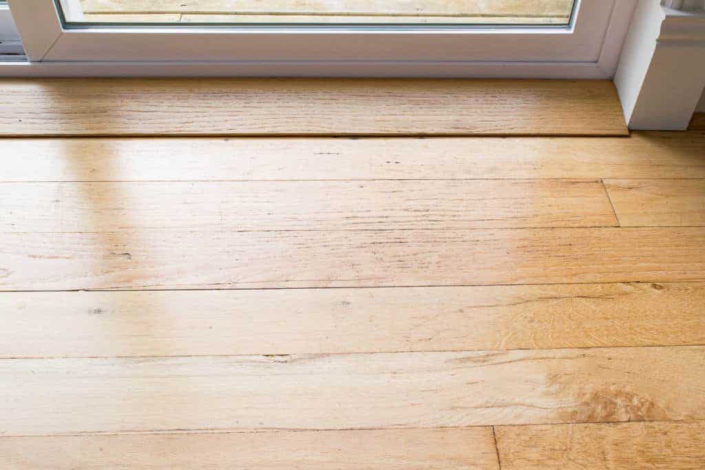 Deep clean old hardwood floors back door before The Handyman s Daughter