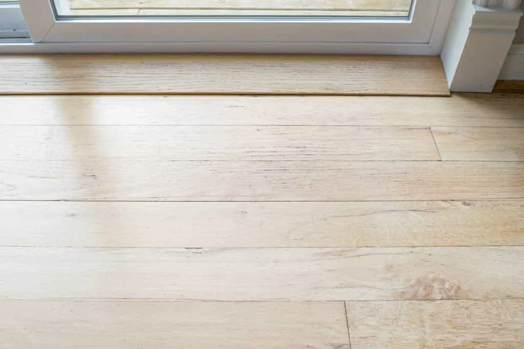 wood floor in front of sliding glass door