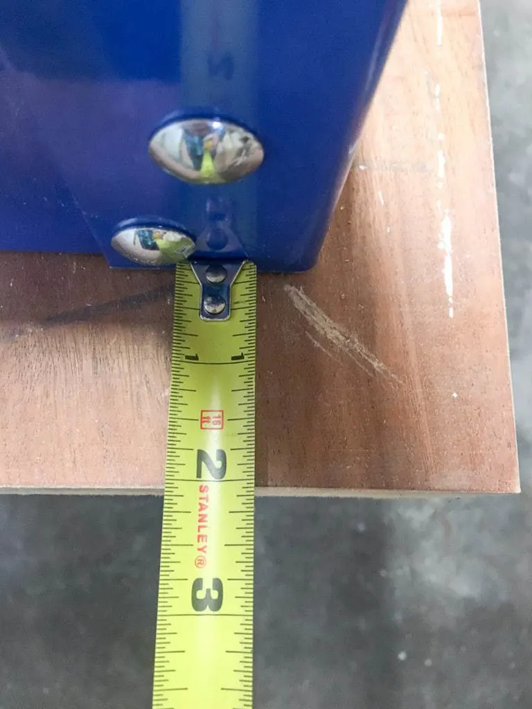 Checking overhang of Kreg workbench with a tape measure