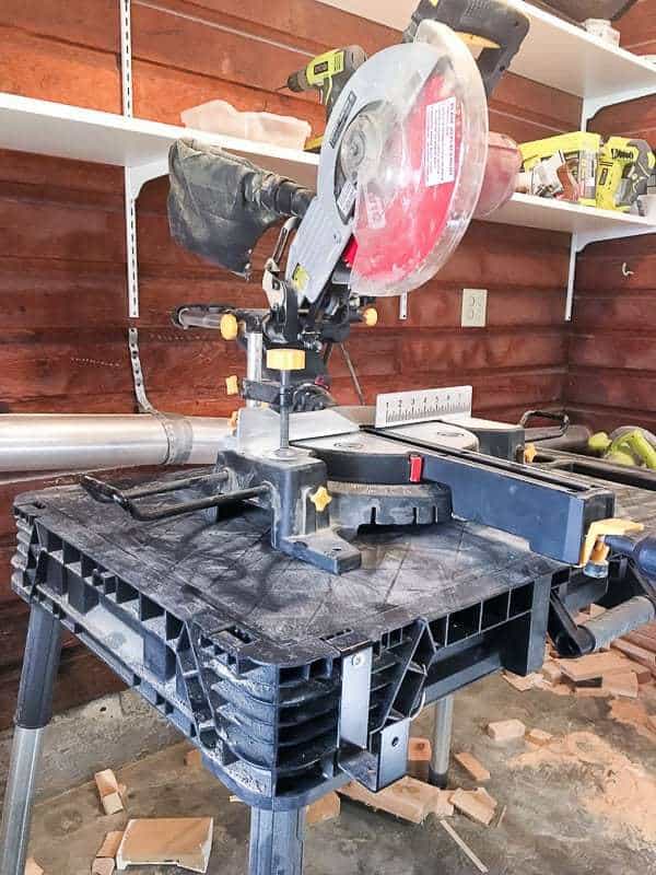 I need to build a new miter saw stand to replace this little worktable I'm currently using.