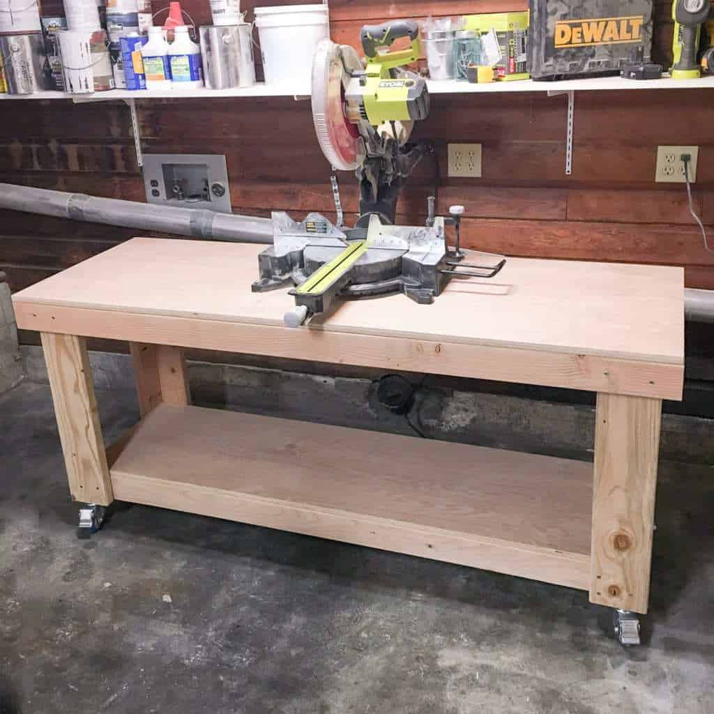 miter saw stand with saw centered on workbench