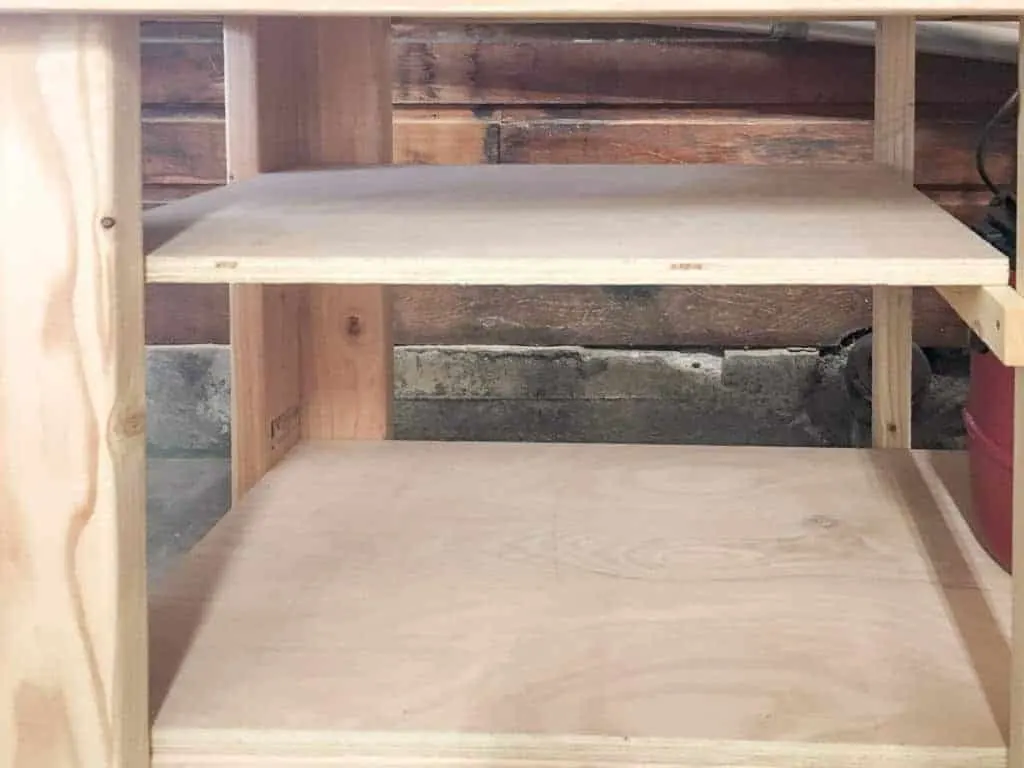 shelves under DIY workbench