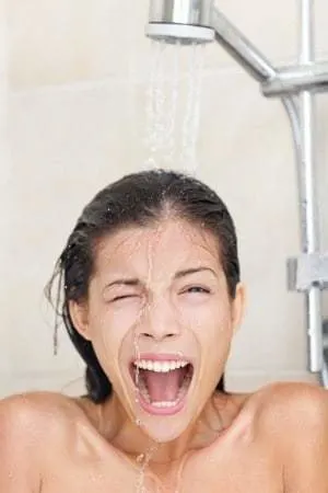 woman yelling because shower water turned cold