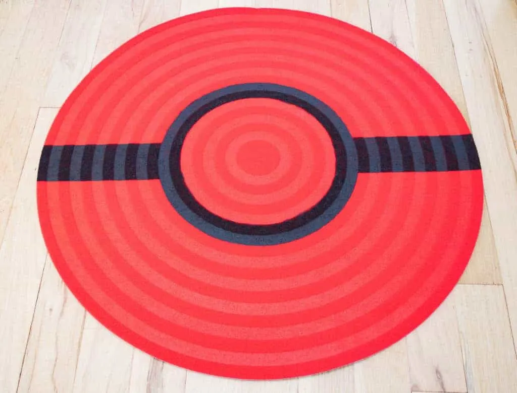 Black stripe of the pokeball rug painted.