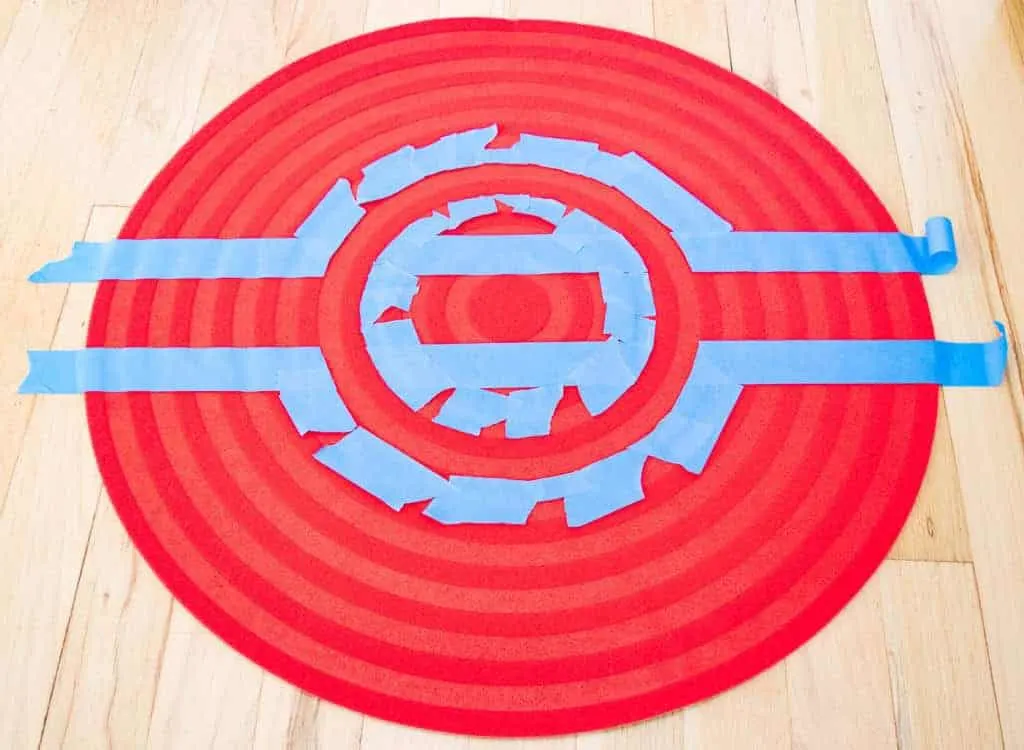 painter's tape around center circle and middle stripe of pokeball rug