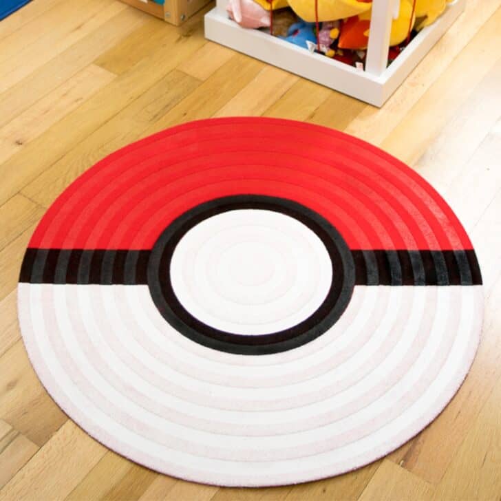 round area rug painted to look like a poke ball