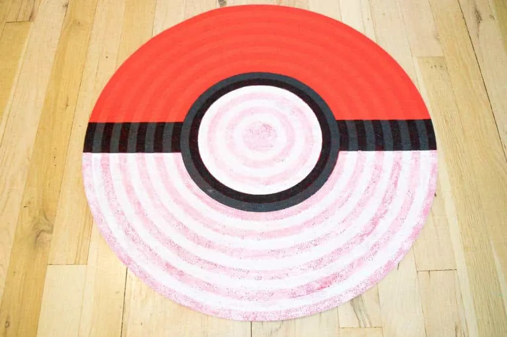 first coat of white paint on pokeball rug is slightly pink